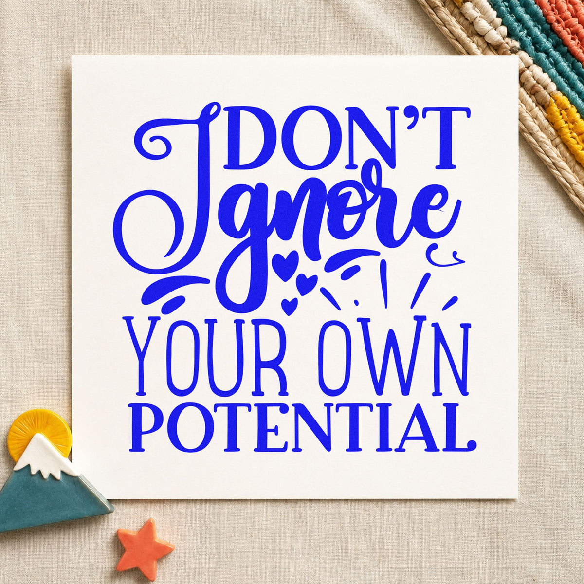 Don't Ignore Your Potential craft stamp imprinted in blue ink on paper, a design suited to framed shop office.