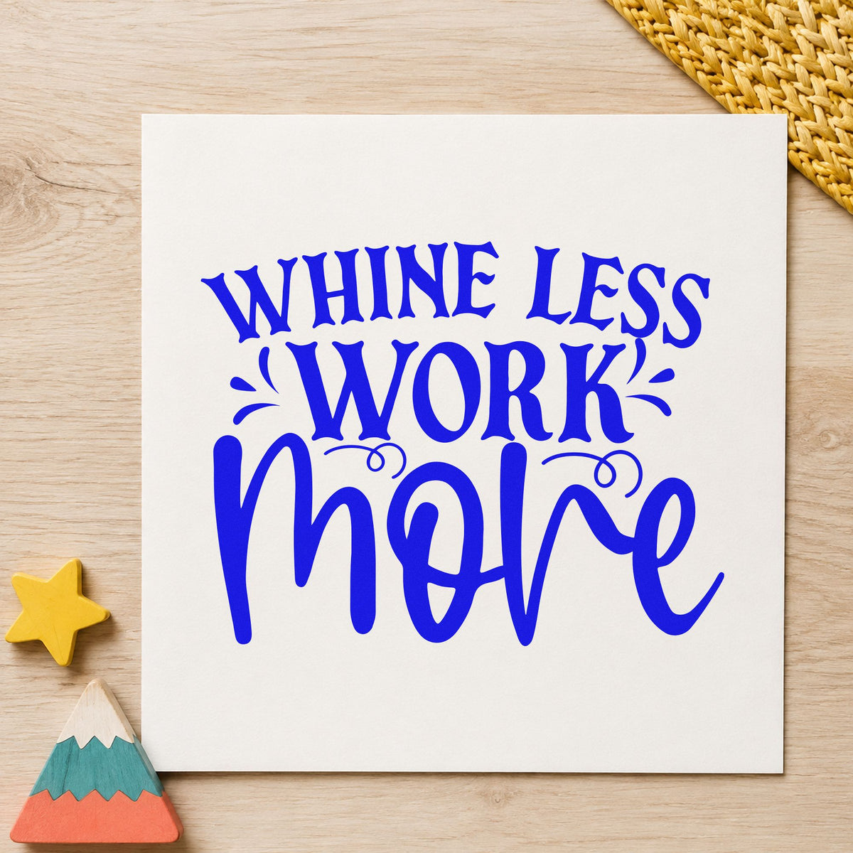 Whine Less Work More craft stamp in blue ink on cardstock, an easy option for laundry bag printing.