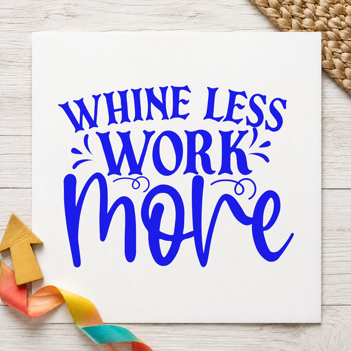 Whine Less Work More craft stamp imprinted in blue ink on paper, a design suited to framed mud room.