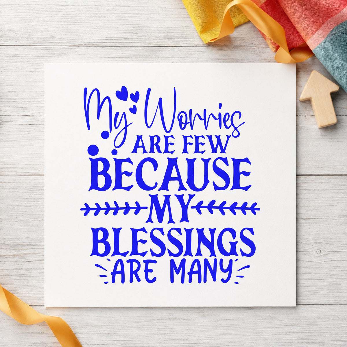Worries Few Blessings Many craft stamp in blue ink on cardstock, an easy option for table cloth printing.