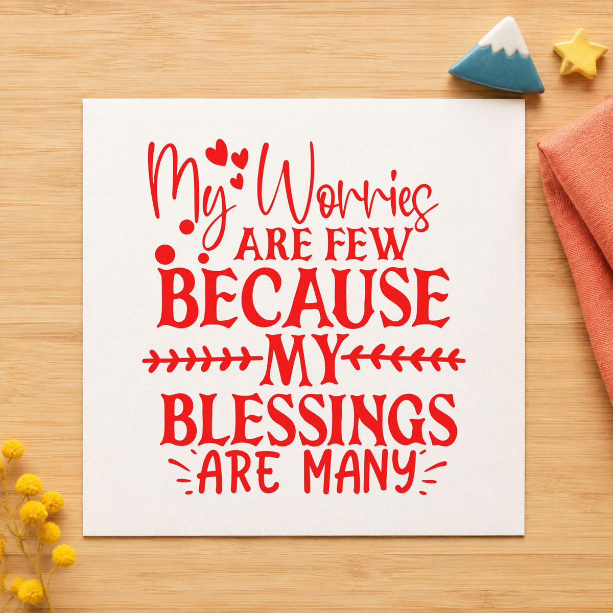 Worries Few Blessings Many craft stamp imprint in red ink on a handmade project, one idea being gratitude slip cards.