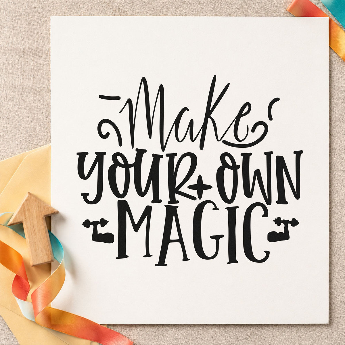 Make Your Own Magic craft stamp imprint in black ink on a handmade project, one idea being trick bag gift tags.