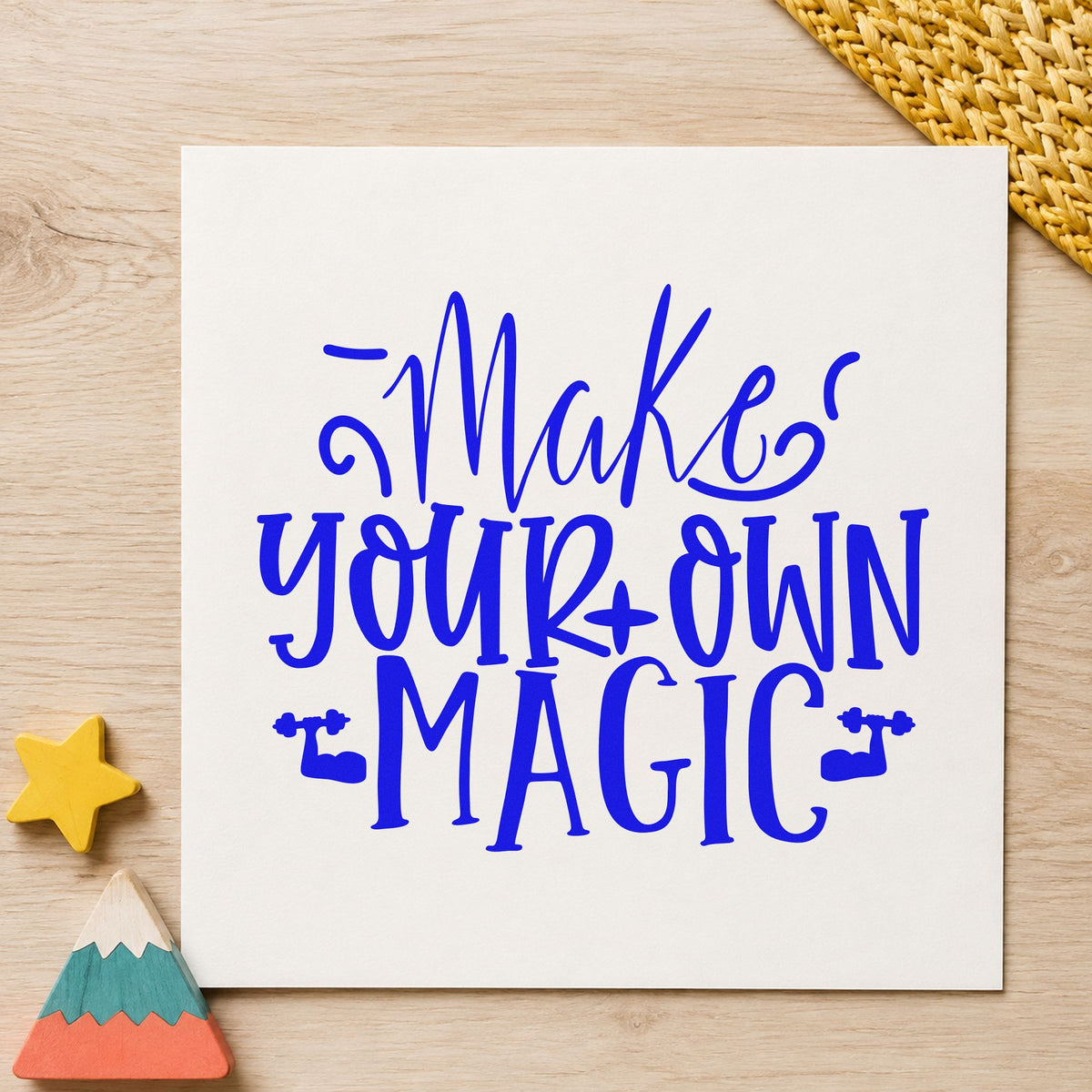 Make Your Own Magic craft stamp imprinted in blue ink on paper, a design suited to framed prop cabinet.