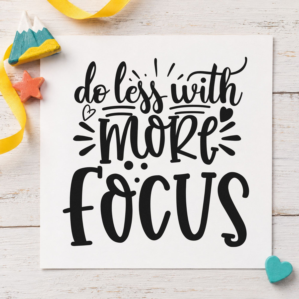 Do Less With More Focus craft stamp imprint in black ink on a handmade project, one idea being client pack gift tags.