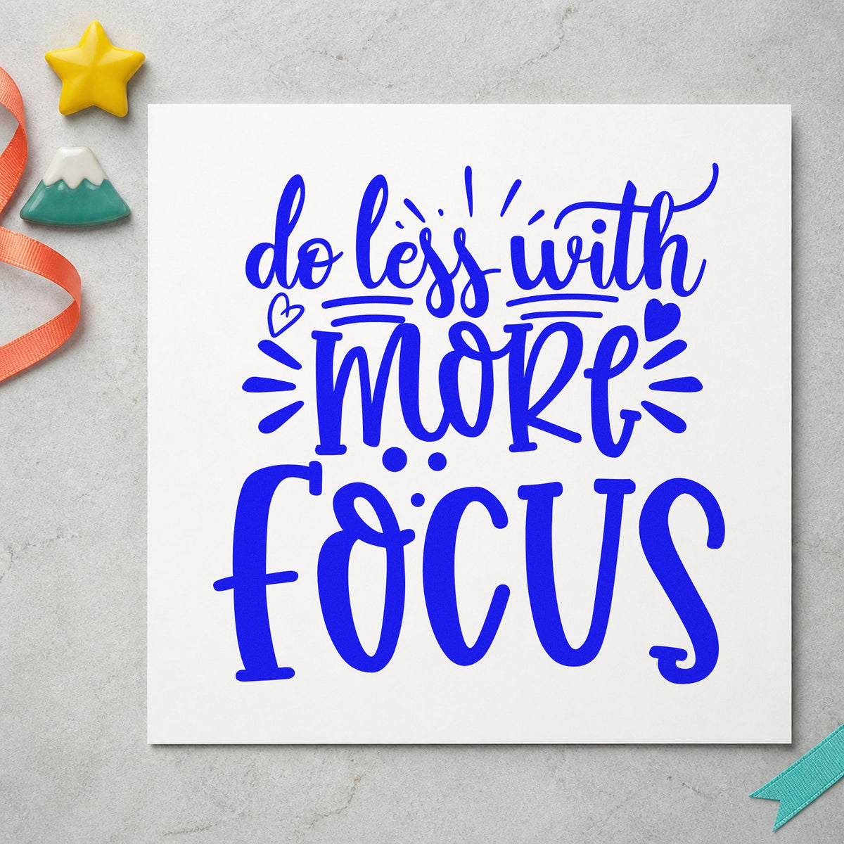 Do Less With More Focus craft stamp in blue ink on cardstock, an easy option for desk runner printing.