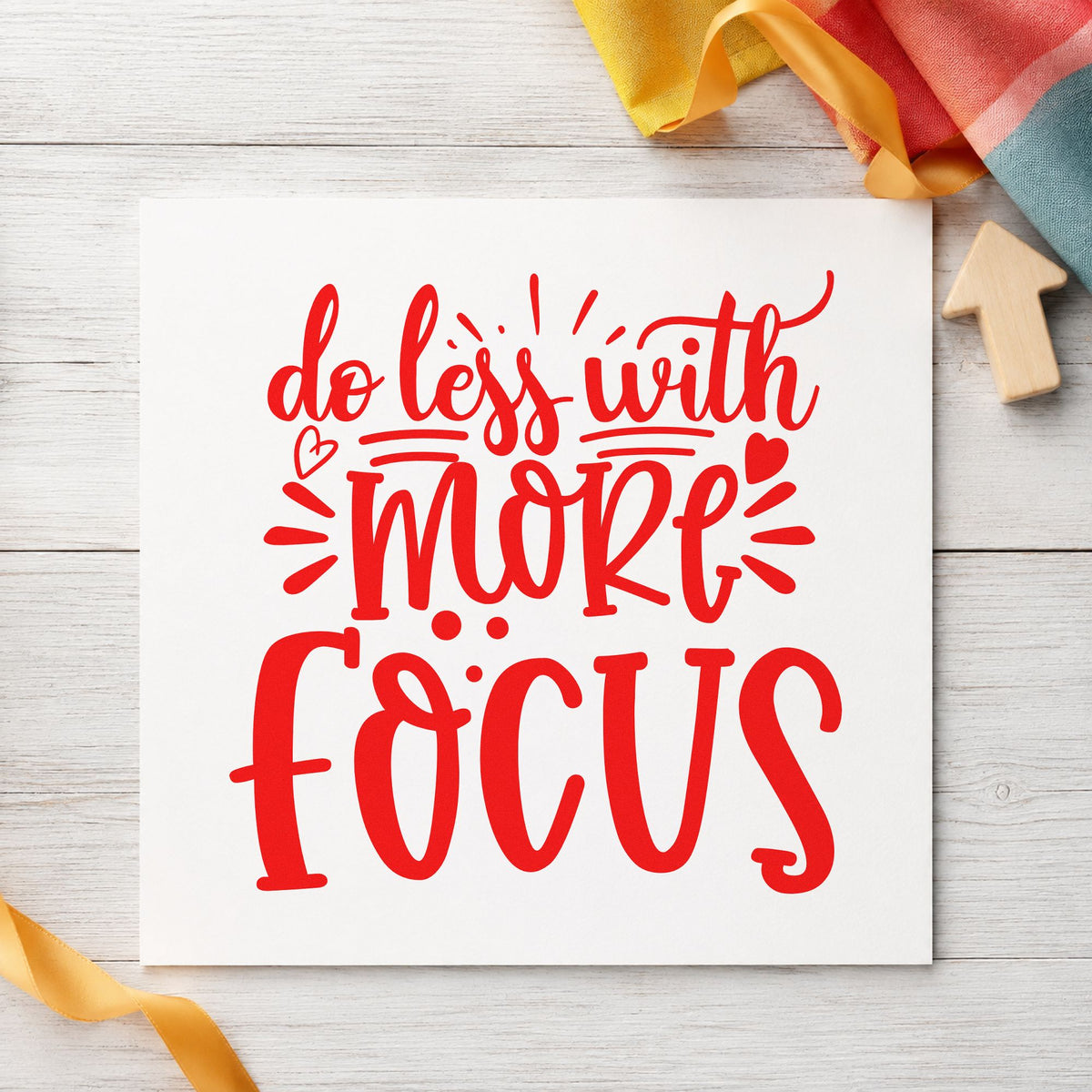 Do Less With More Focus craft stamp imprint in red ink on a handmade project, one idea being invoice log cards.