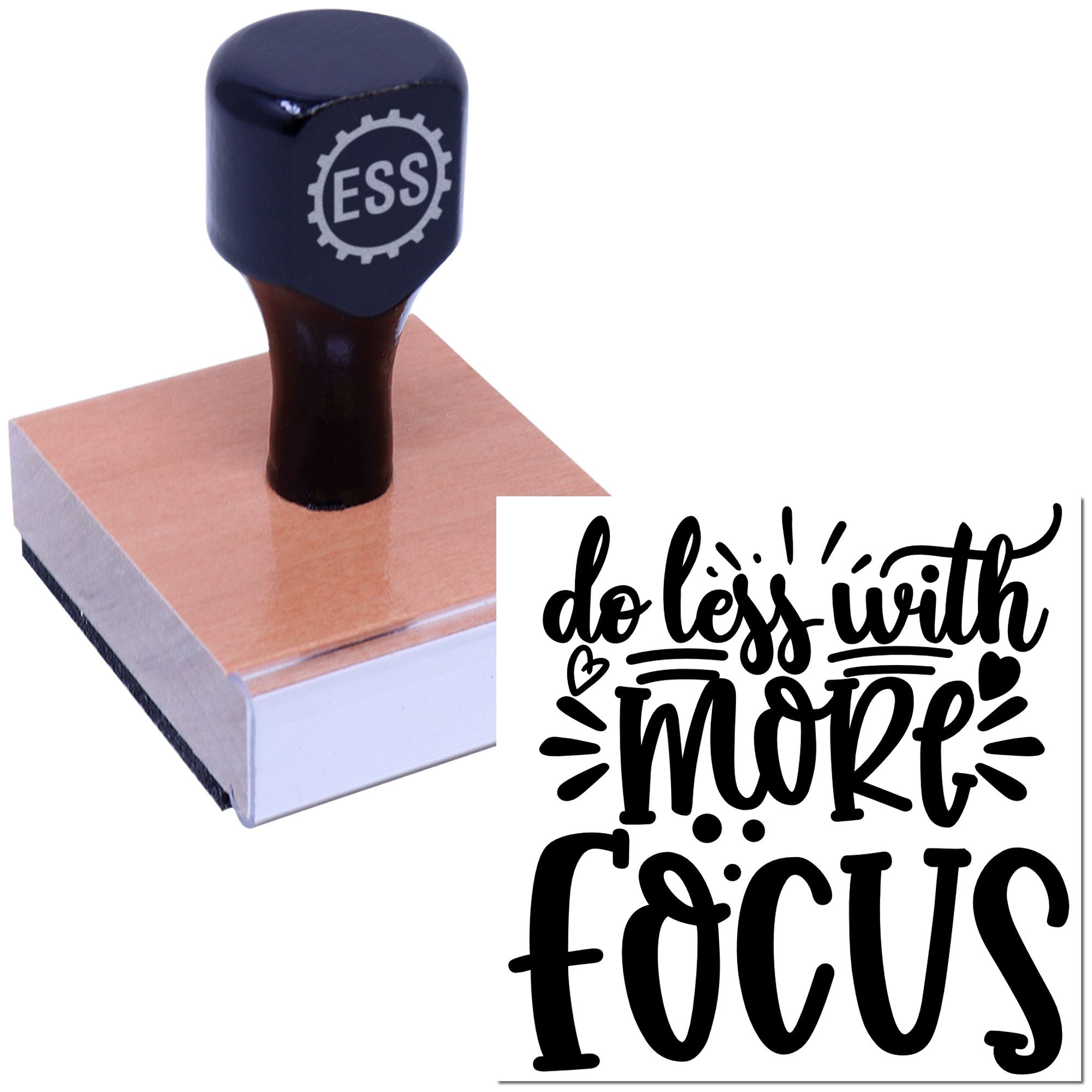 Black ESS rubber stamp and seal on pink block with do less with more focus script and heart accents.