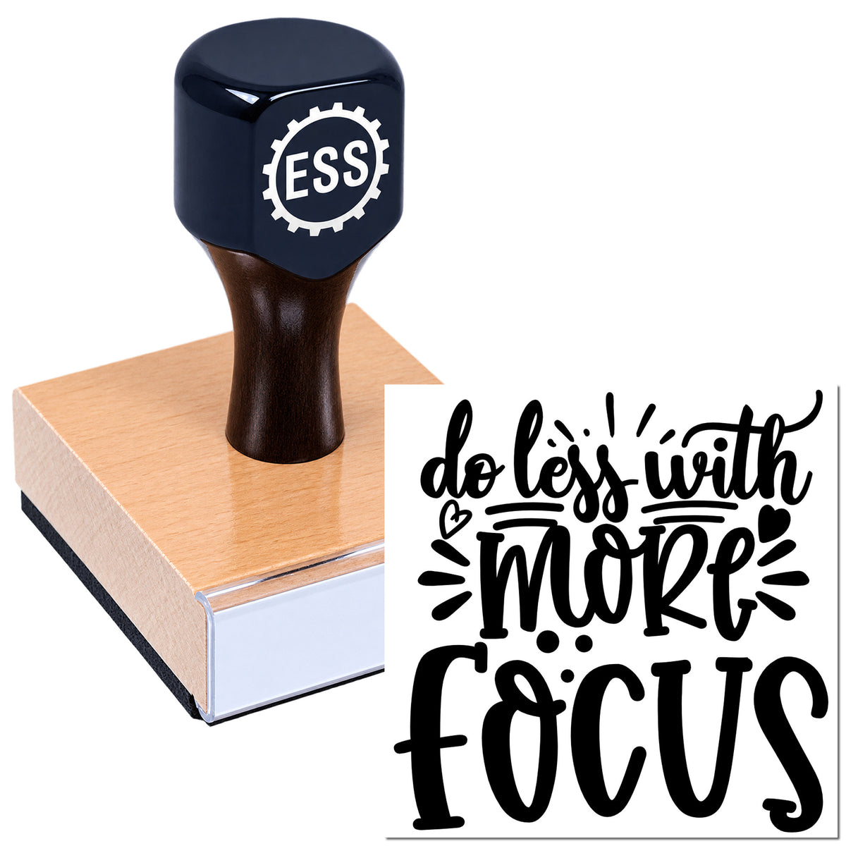 Black ESS rubber stamp and seal on pink block with "do less with more focus" script and heart accents.