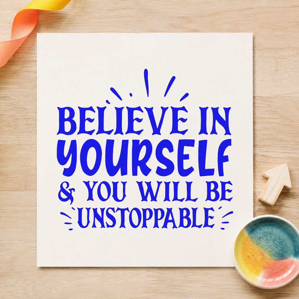 Believe Yourself Be Unstoppable craft stamp imprinted in blue ink on paper, a design suited to framed gym corner.