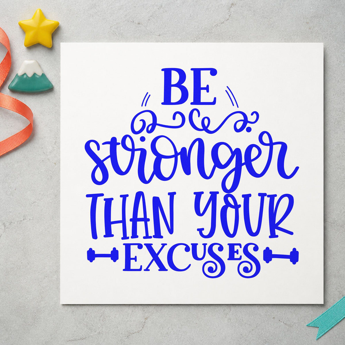 Stronger Than Your Excuses craft stamp imprinted in blue ink on paper, a design suited to framed garage gym.