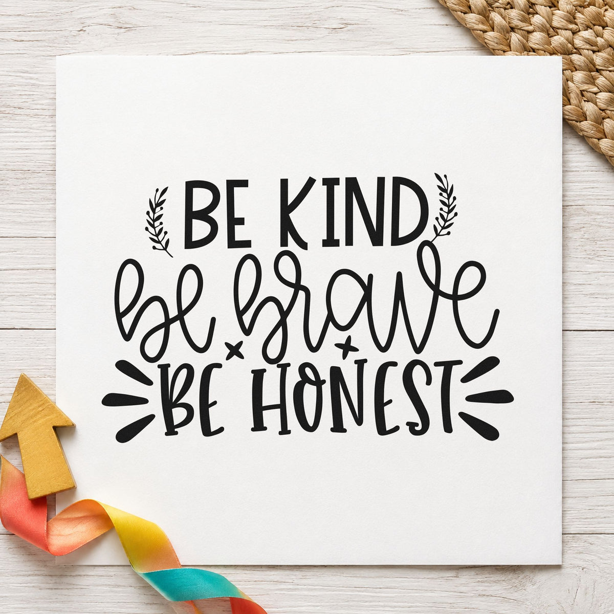 Be Kind Brave Honest craft stamp imprint in black ink on a handmade project, one idea being badge pack gift tags.