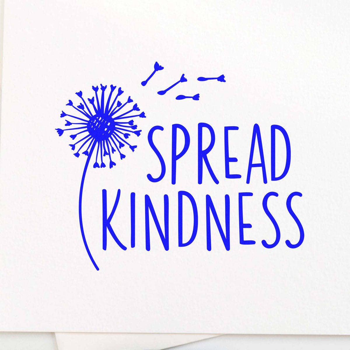 Blue Spread Kindness rubber stamp with dandelion seal design on white background
