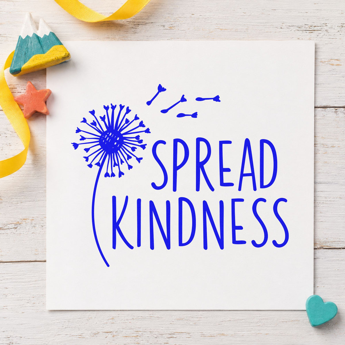 Spread Kindness Dandelion Seeds craft stamp in blue ink on cardstock, an easy option for garden flag printing.
