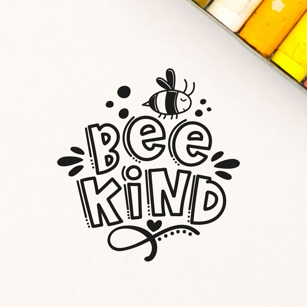 Black Bee Kind stamp and seal design on white, with playful bee icon, bold lettering, and yellow corner accents.