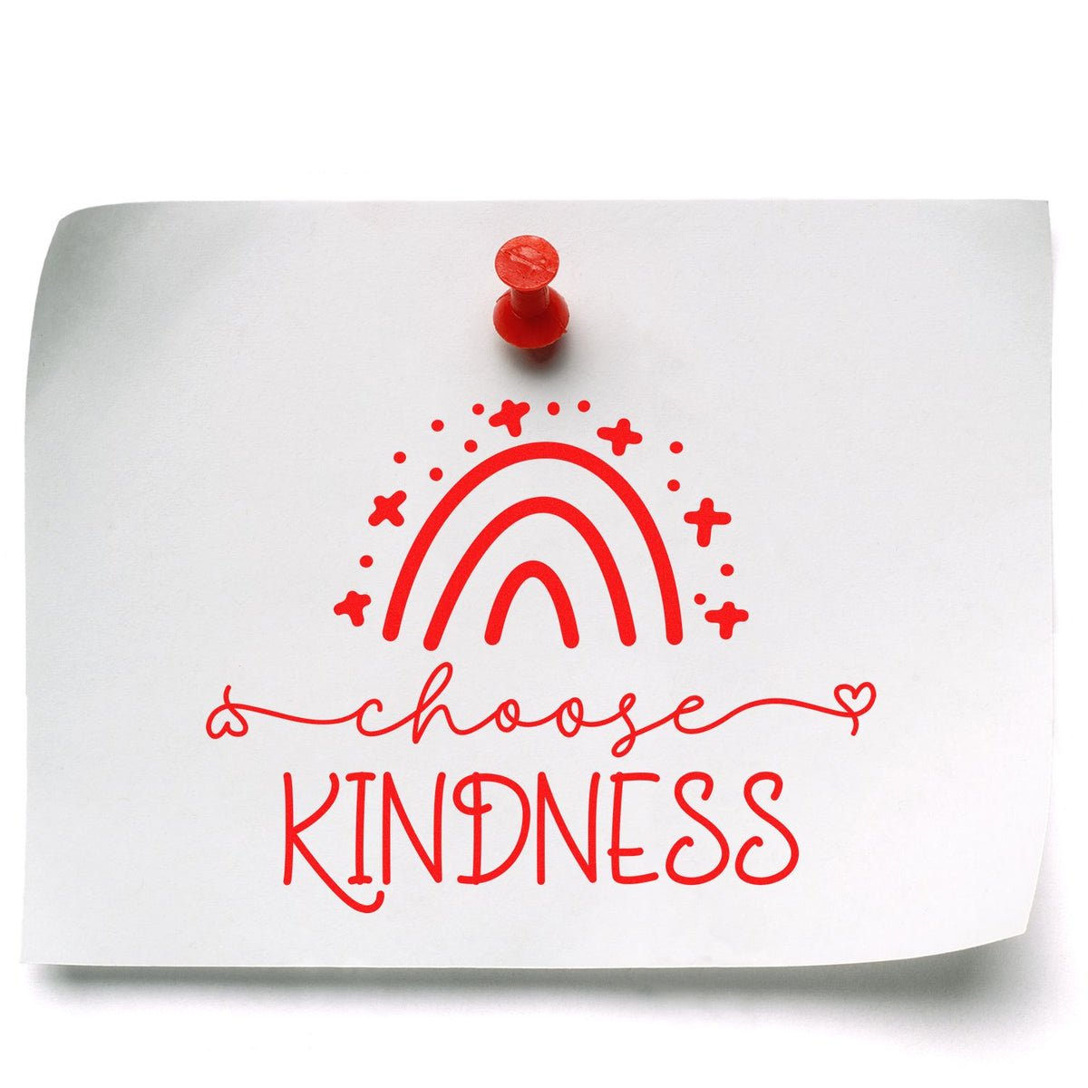 Red rubber stamp seal on white paper with rainbow and choose kindness text in bright red.