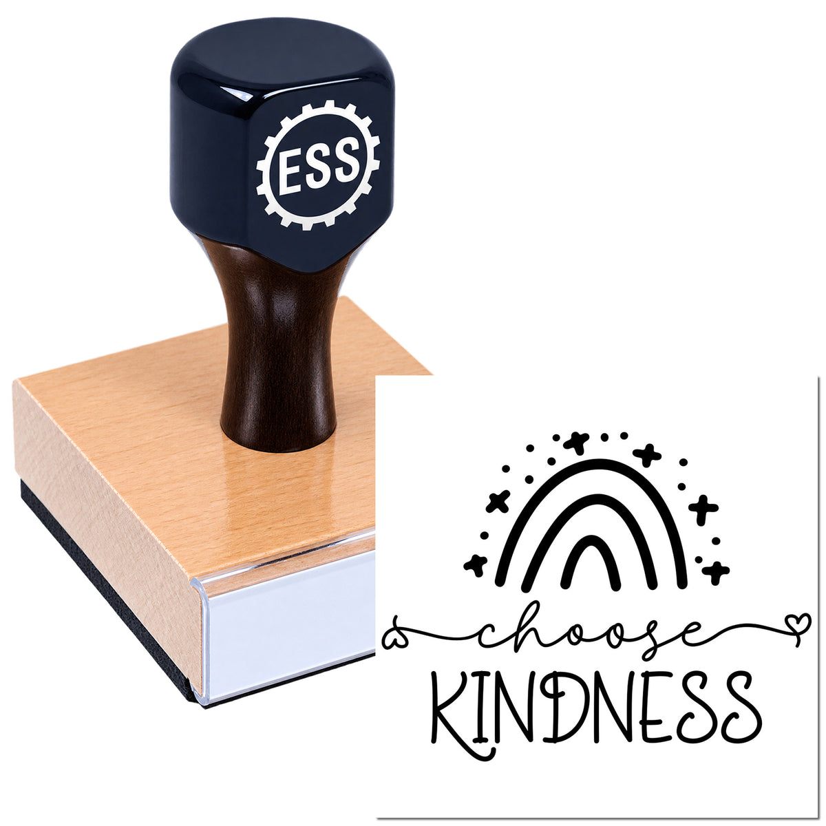 Dark navy ESS custom stamp with wooden handle on a block, beside a black "choose kindness" rainbow seal design.
