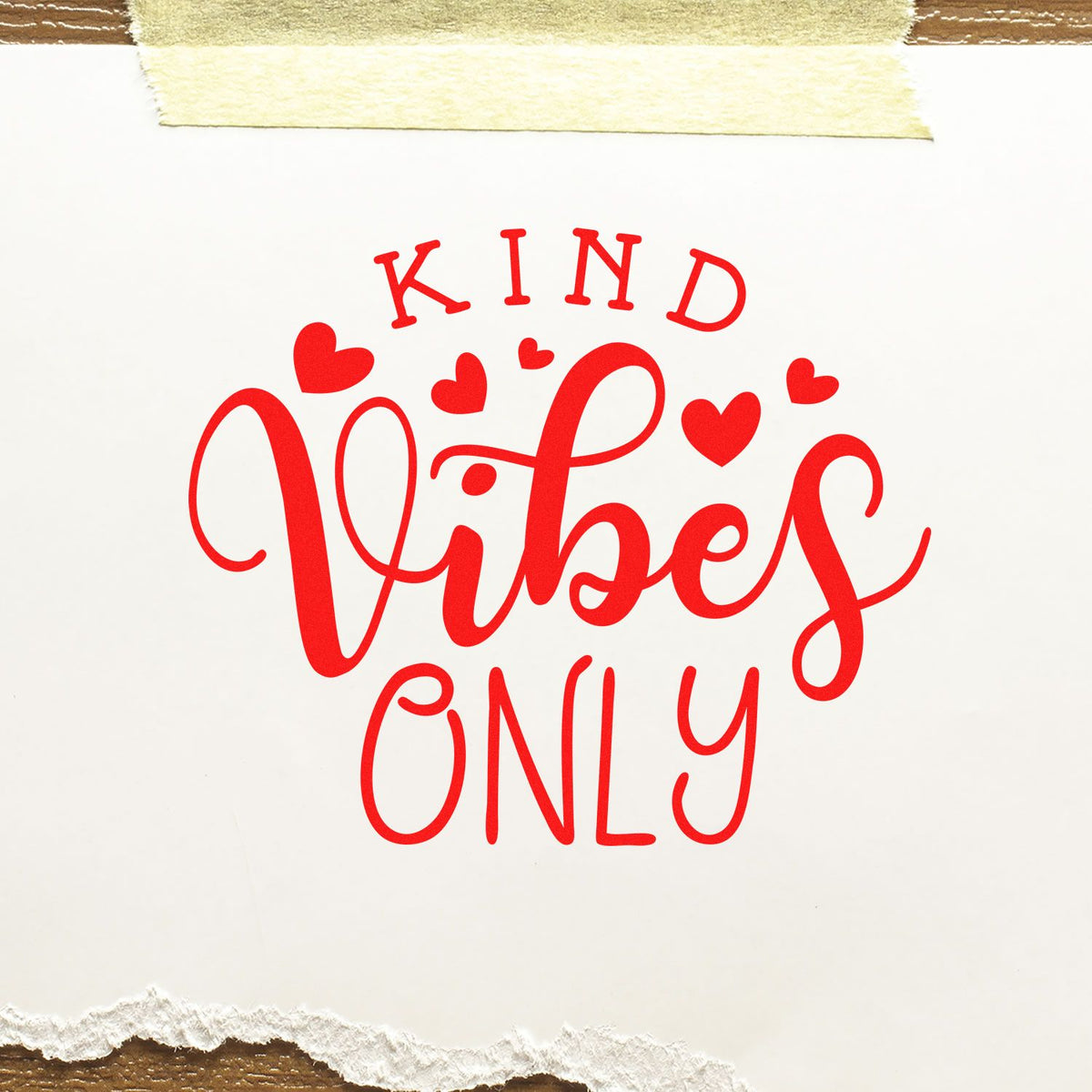 Red Kind Vibes Only stamp with hearts on white paper, taped top and torn bottom edge for seal products.