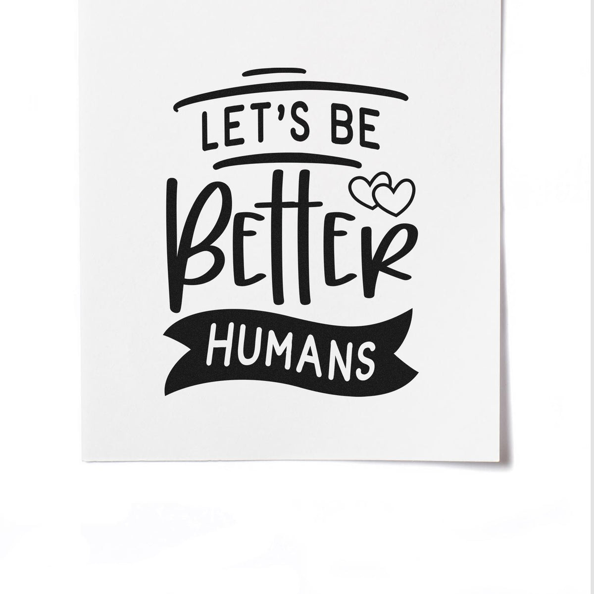 Black custom stamp and seal design reading Lets Be Better Humans with heart icons on a white background.
