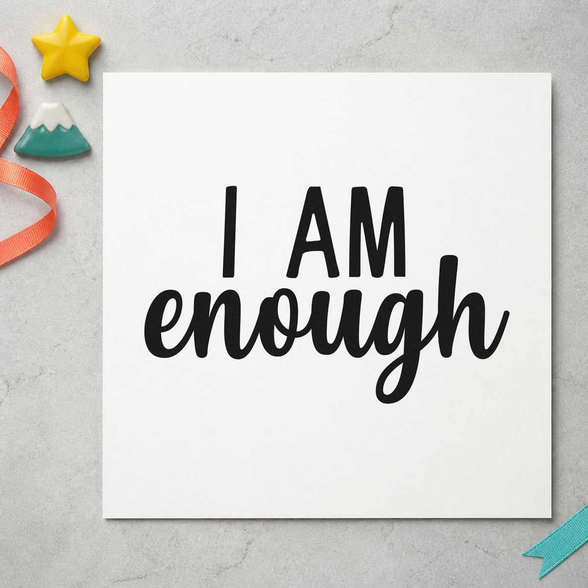 I Am Enough Lettering craft stamp imprint in black ink on a handmade project, one idea being meeting gift tags.