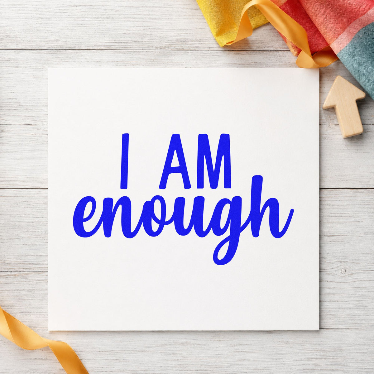 I Am Enough Lettering craft stamp imprinted in blue ink on paper, a design suited to framed meeting room.