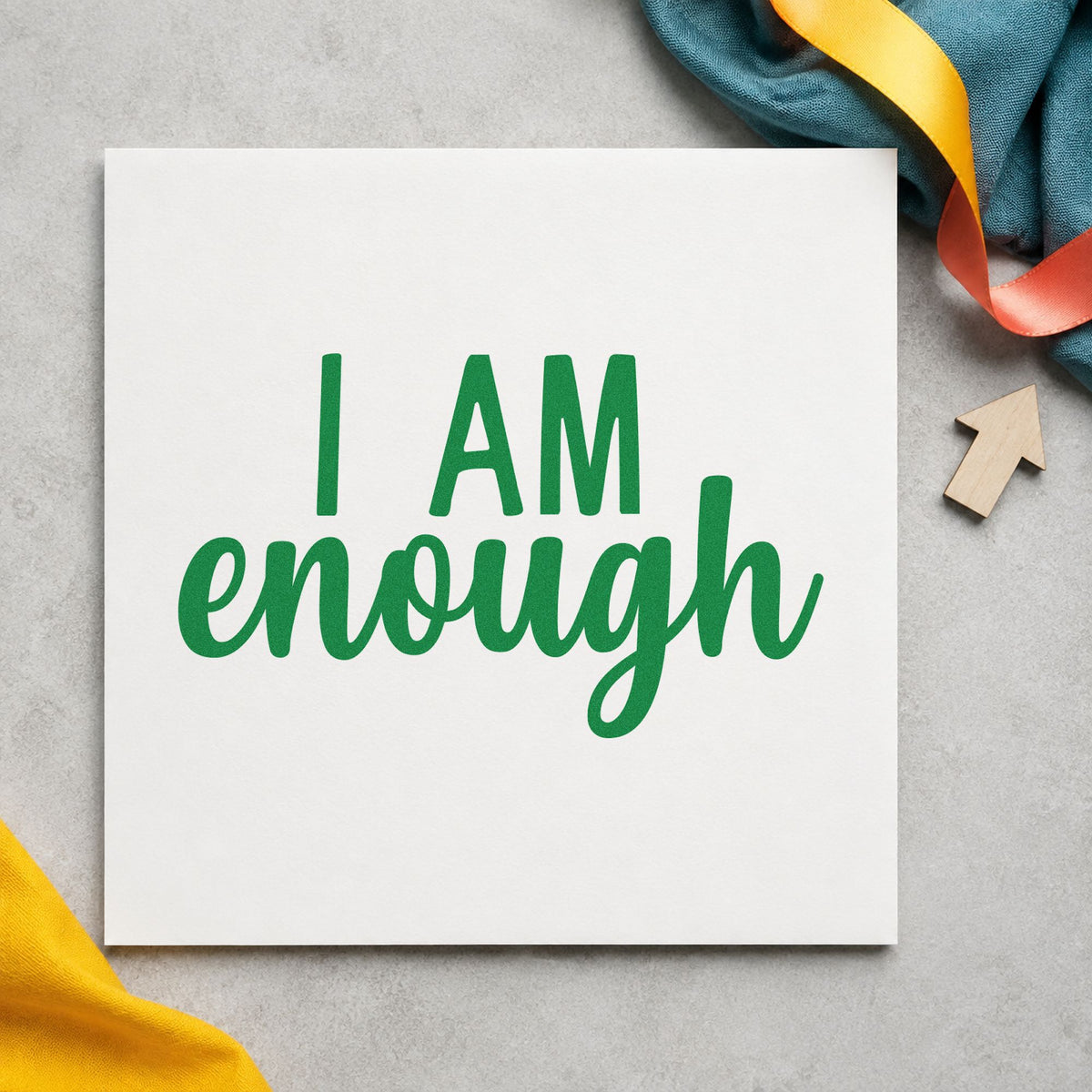 I Am Enough Lettering craft stamp imprint in green ink on a handmade project, one idea being affirm slip cards.