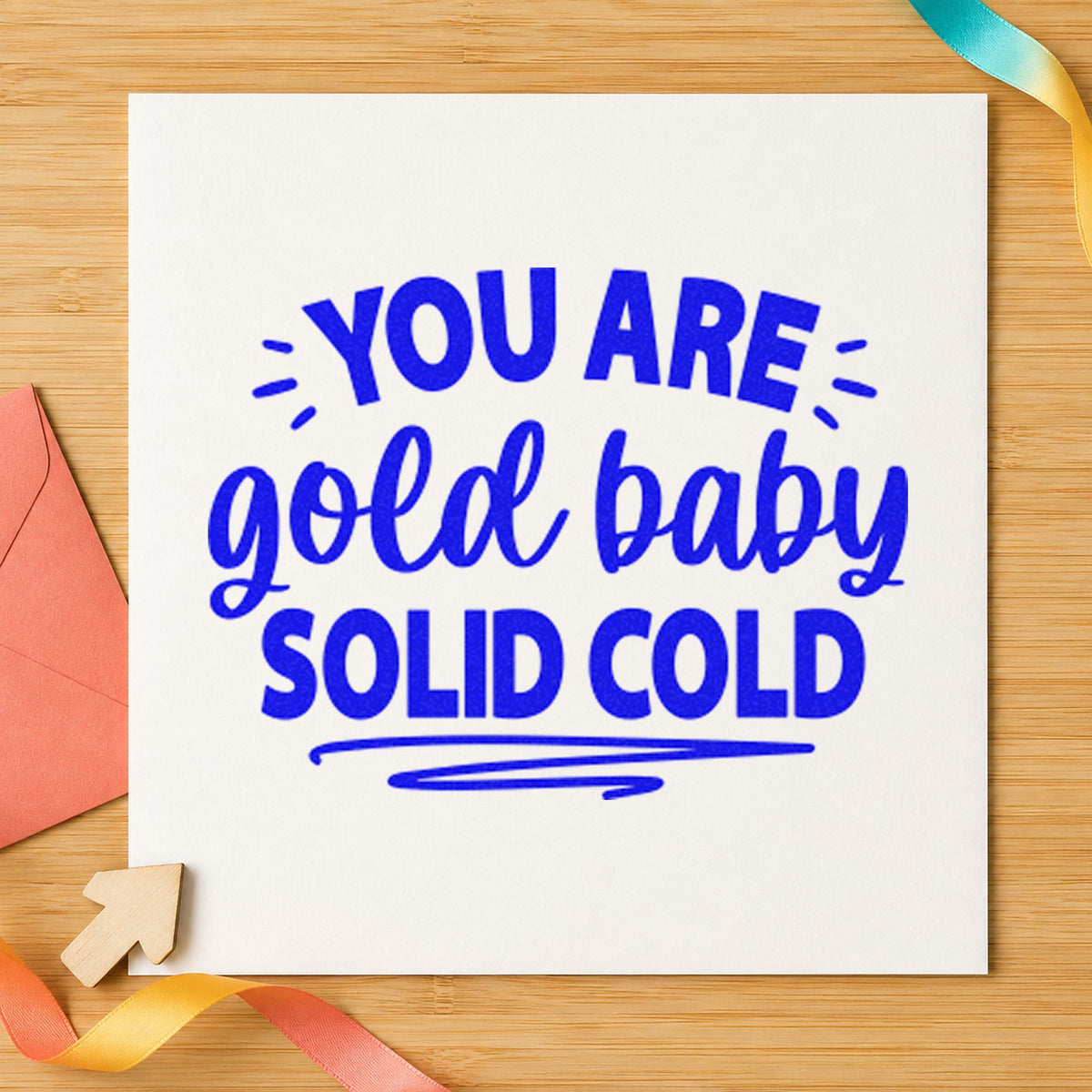 You Are Solid Gold craft stamp imprinted in blue ink on paper, a design suited to framed party corner.