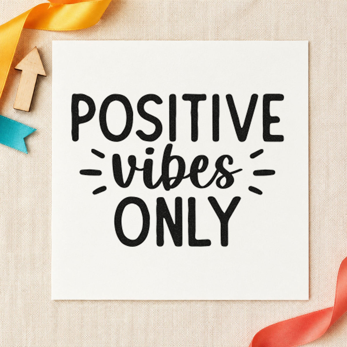 Positive Vibes Only Rays craft stamp imprint in black ink on a handmade project, one idea being welcome basket tags.