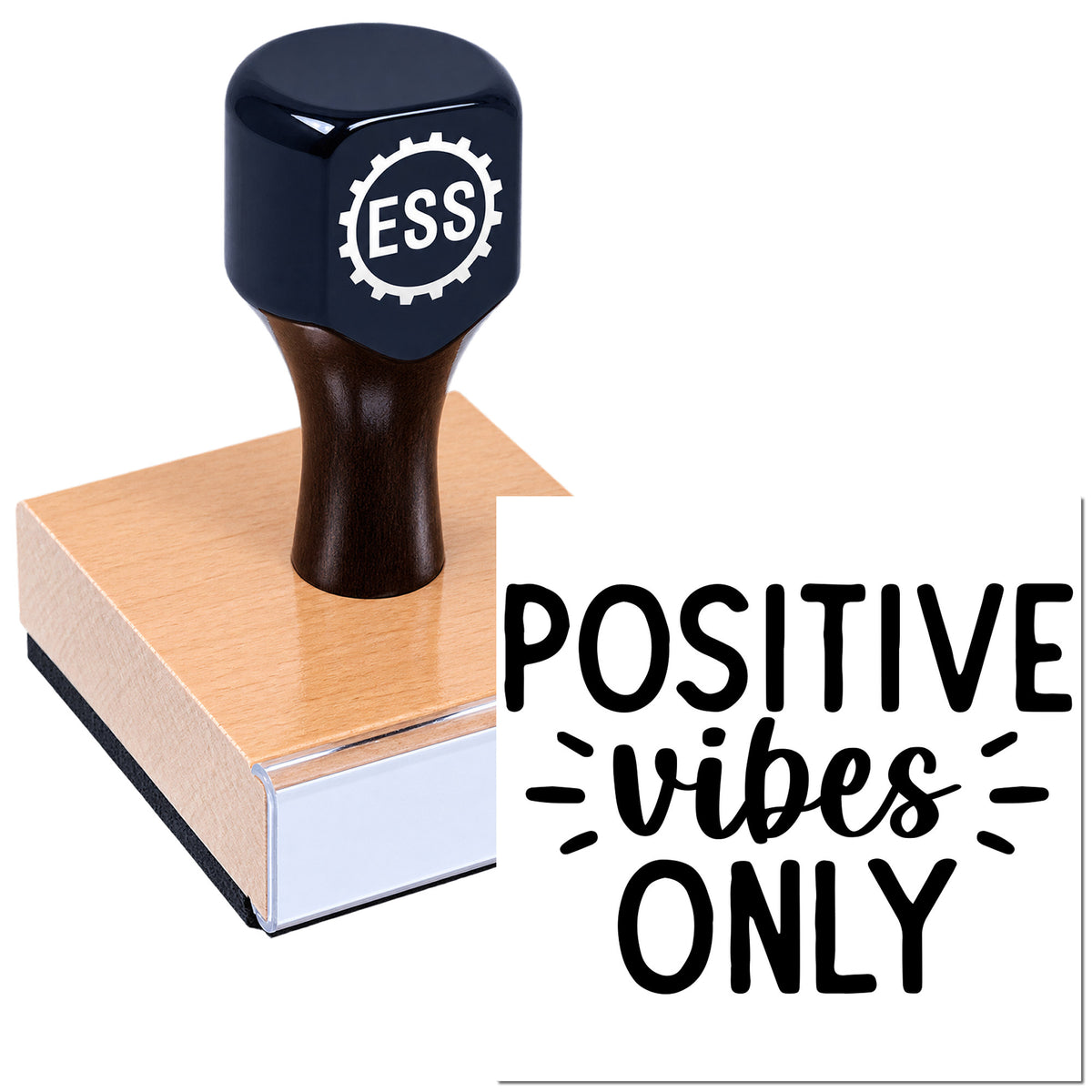 Black rubber stamp with ESS logo on a peach block beside a white seal reading "Positive vibes only" in bold black lettering.