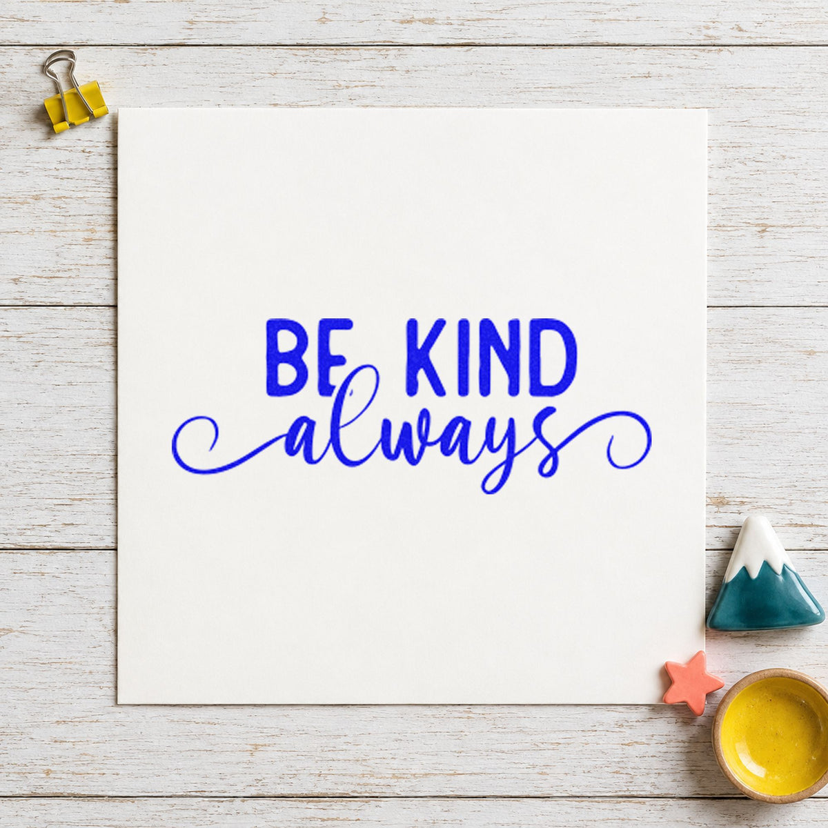 Be Kind Always Script craft stamp imprinted in blue ink on paper, a design suited to framed writing desk.