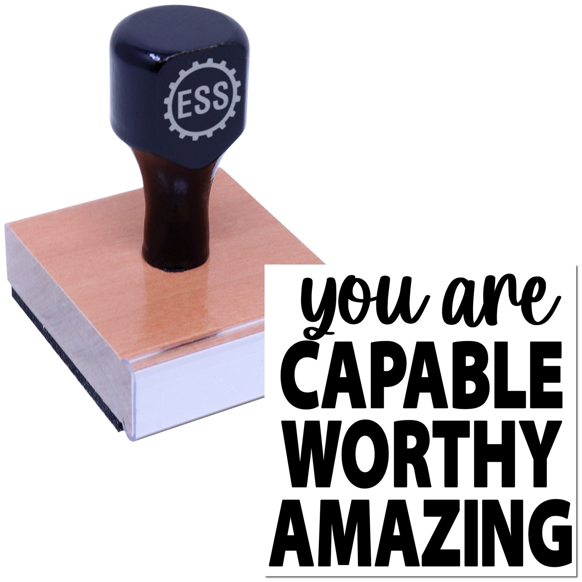 Navy custom rubber stamp seal with ESS logo on a pink block, beside black text: you are capable, worthy, amazing.