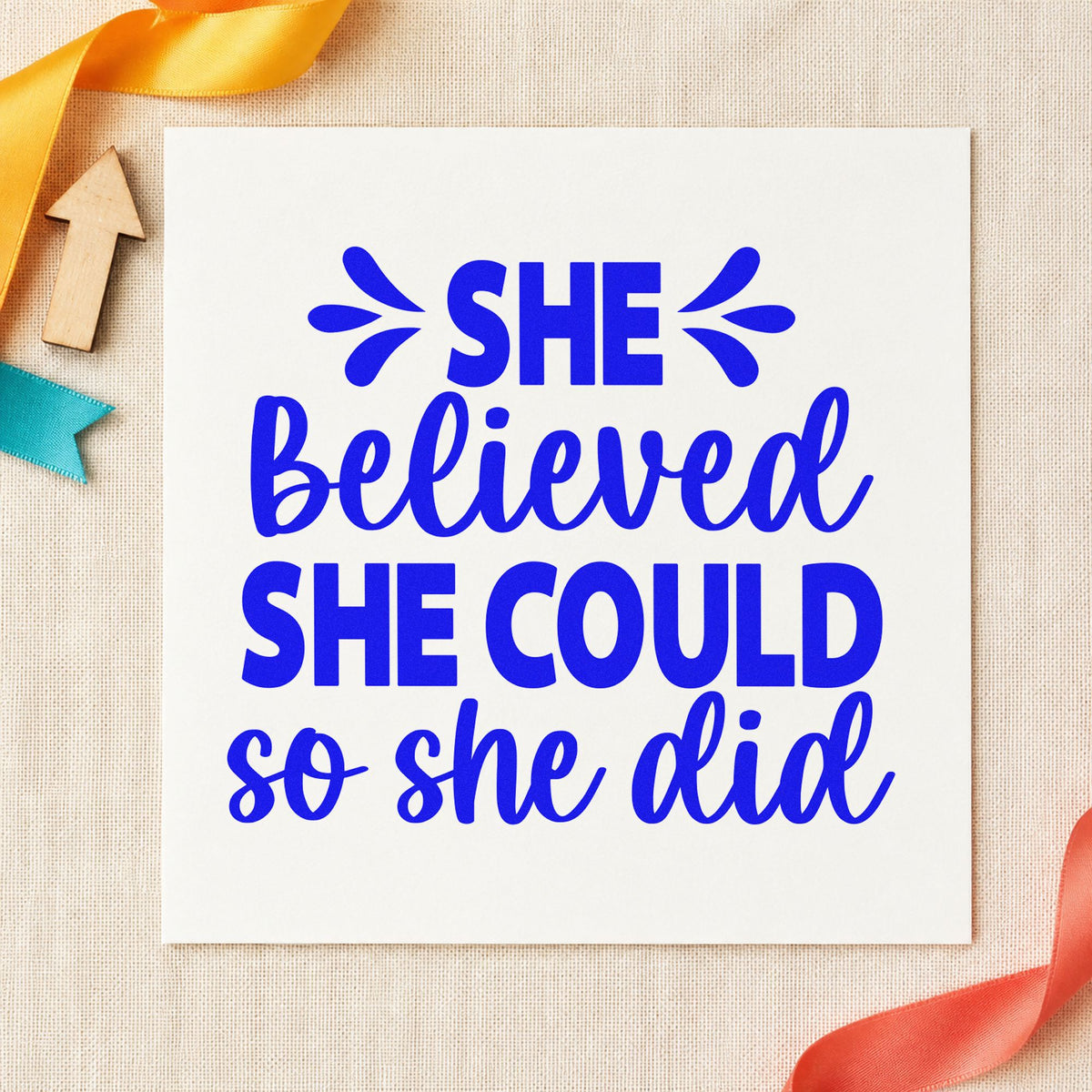 She Believed She Could craft stamp in blue ink on cardstock, an easy option for event banner printing.