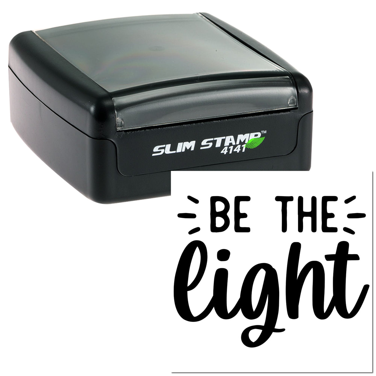 Black Slim Stamp 4141 self-inking seal with translucent gray cap, displaying Be The Light in bold script.