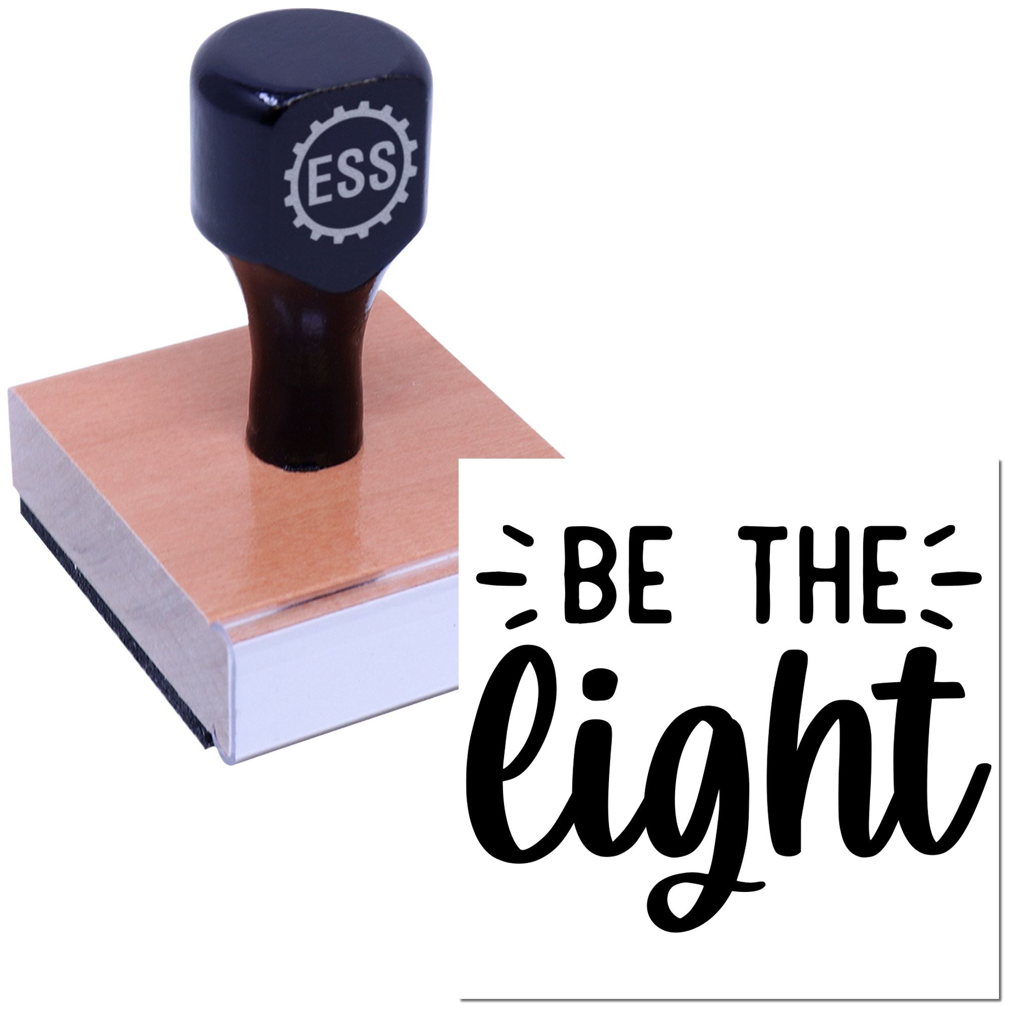 Dark blue custom rubber stamp and seal on copper-toned base with black Be the light lettering.