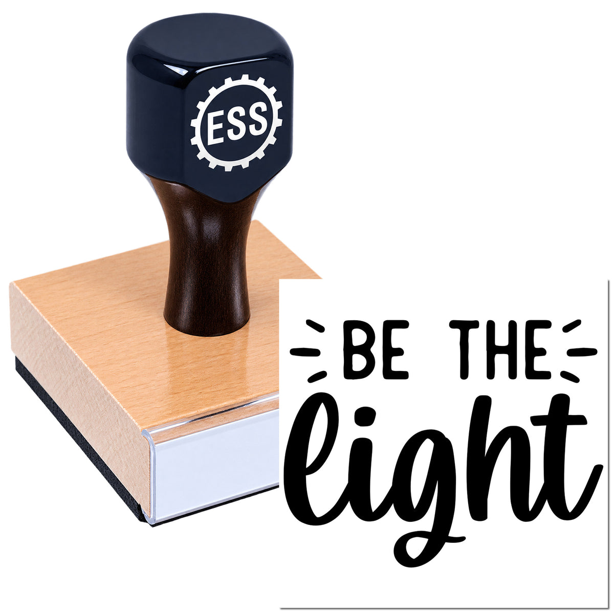 Dark blue custom rubber stamp and seal on copper-toned base with black "Be the light" lettering.