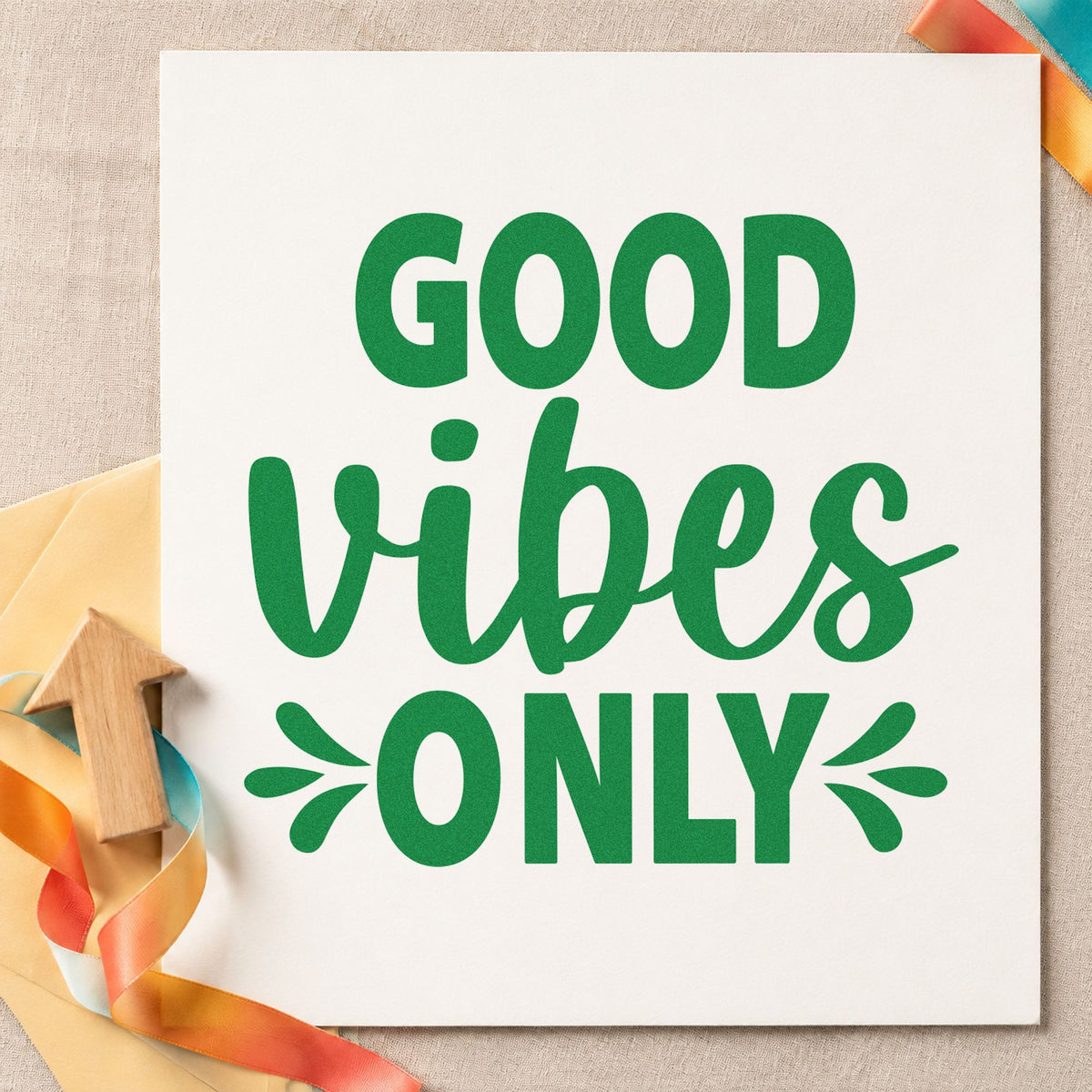 Good Vibes Only Splashes craft stamp imprint in green ink on a handmade project, one idea being special board cards.