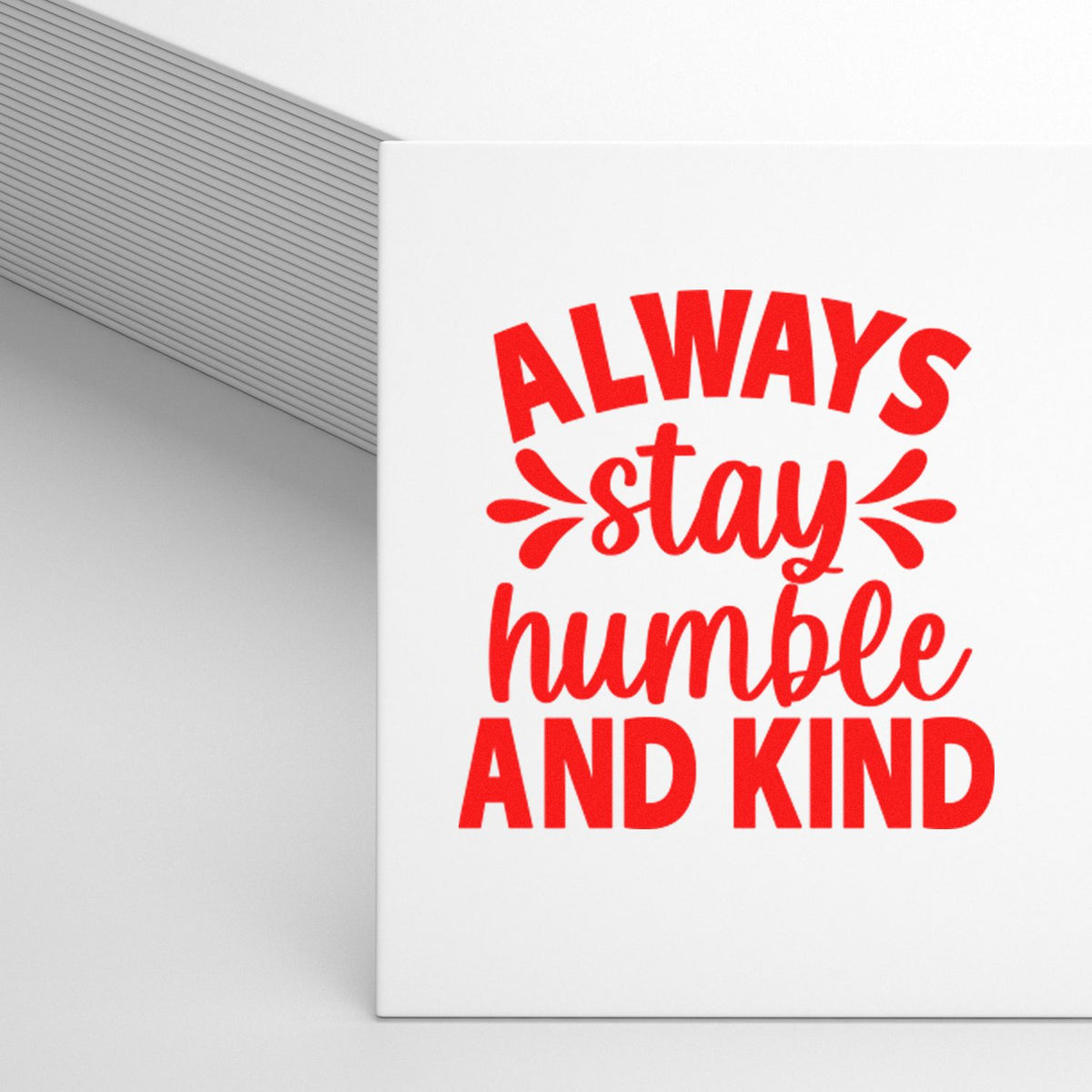 White custom stamp and seal with bold red Always stay humble and kind lettering and decorative flourishes.
