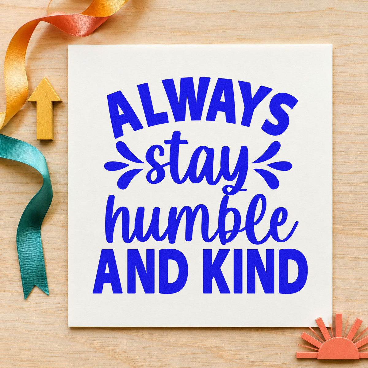 Always Stay Humble And Kind craft stamp in blue ink on cardstock, an easy option for server apron printing.