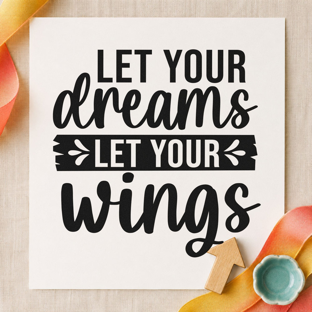 Let Your Dreams Wings craft stamp imprint in black ink on a handmade project, one idea being seed packet tags.