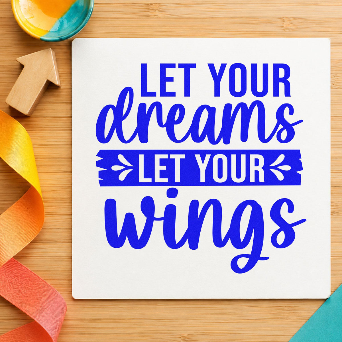 Let Your Dreams Wings craft stamp in blue ink on cardstock, an easy option for garden banner printing.