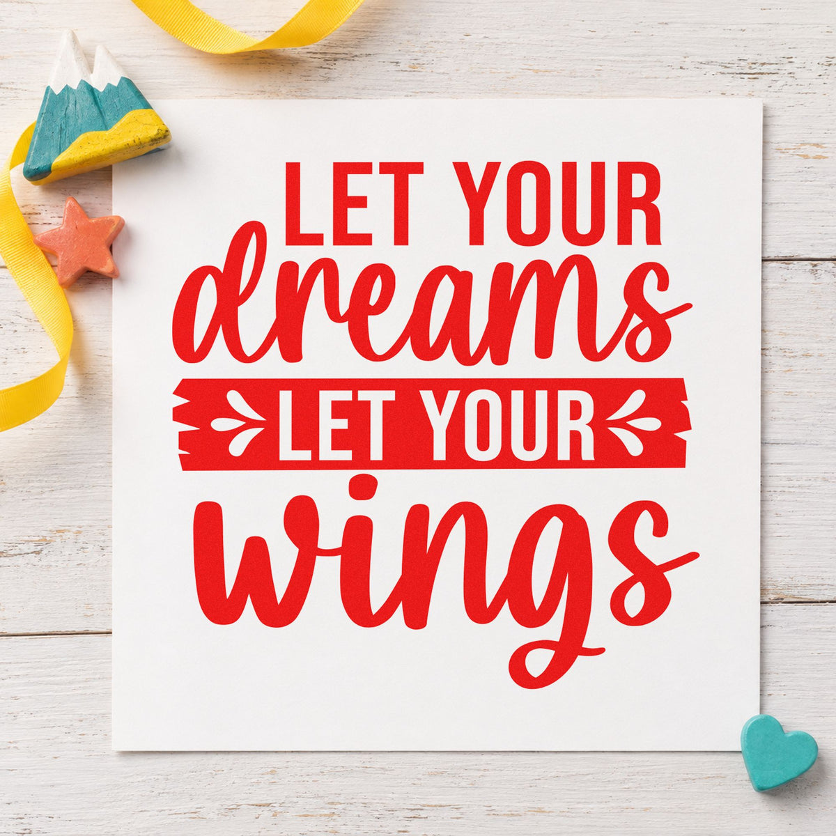 Let Your Dreams Wings rubber stamp shown in red ink, stamped for projects such as bed host labels.