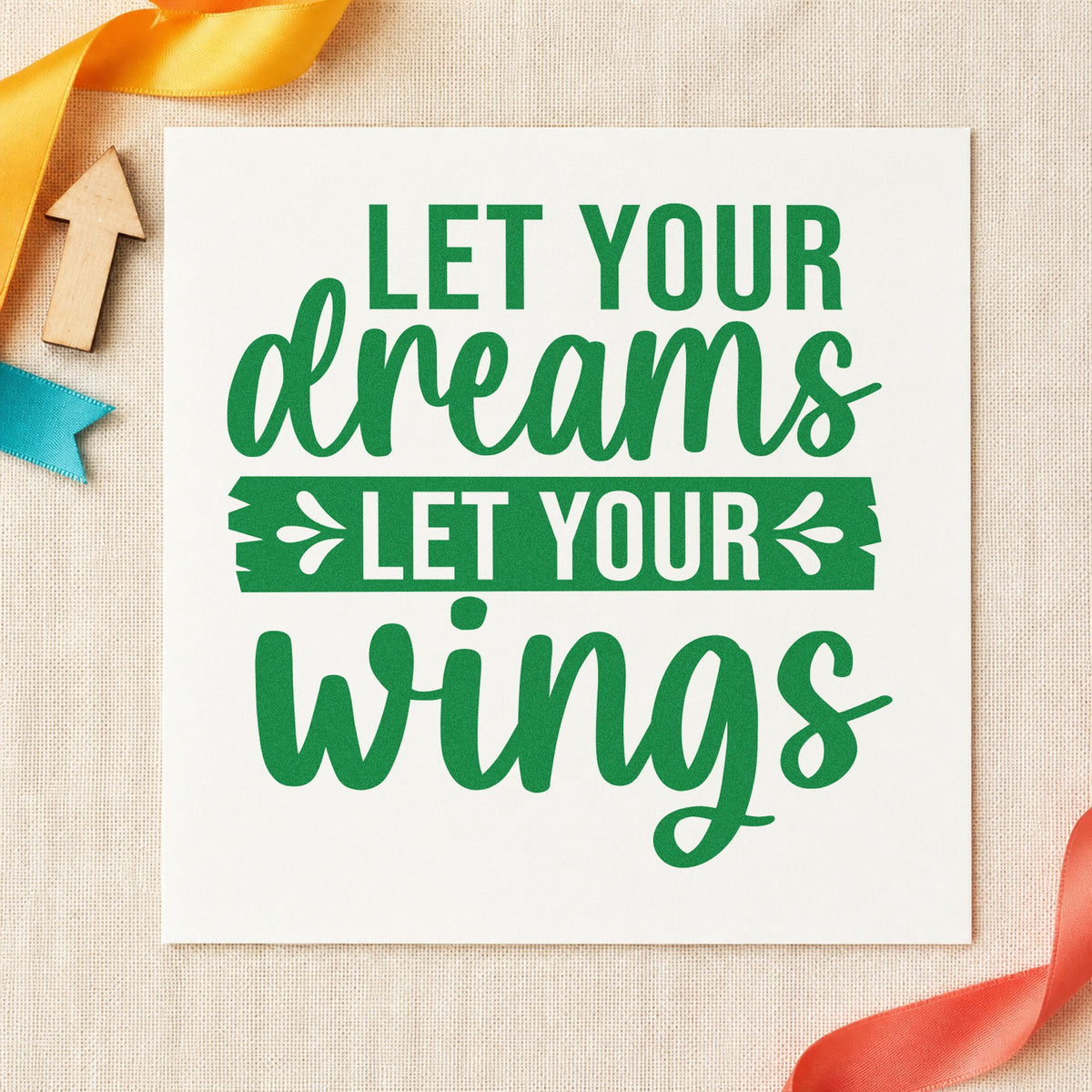 Let Your Dreams Wings craft stamp imprint in green ink on a handmade project, one idea being sighting tally cards.