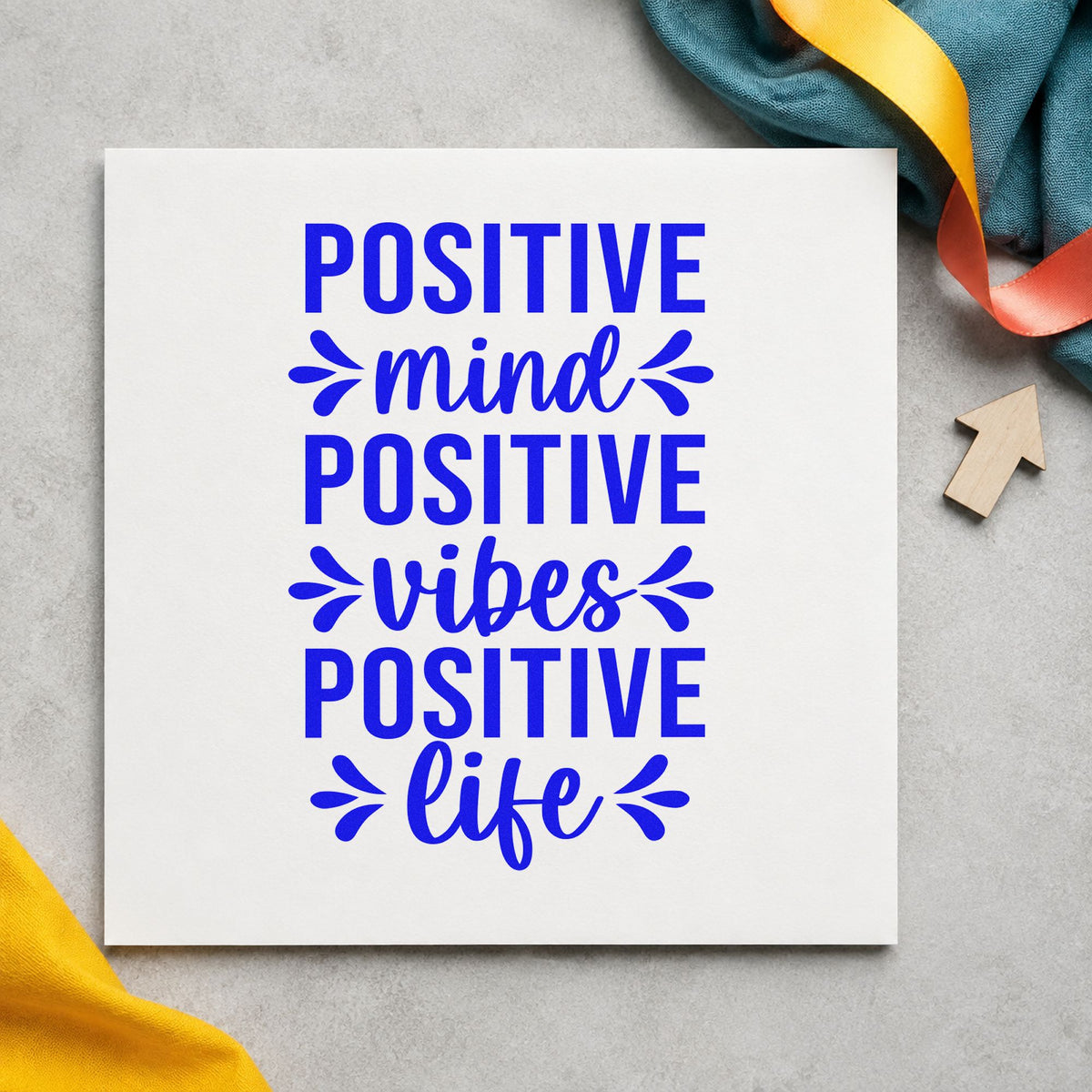 Positive Mind Vibes Life craft stamp imprinted in blue ink on paper, a design suited to framed fridge side.