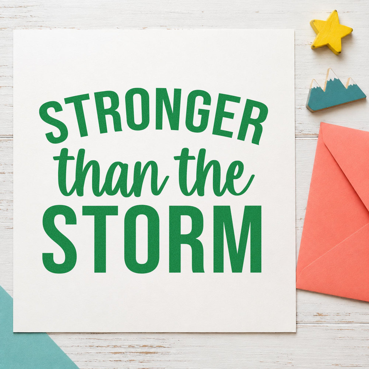 Stronger Than The Storm craft stamp in green ink on cardstock, an easy option for cleanup album page.
