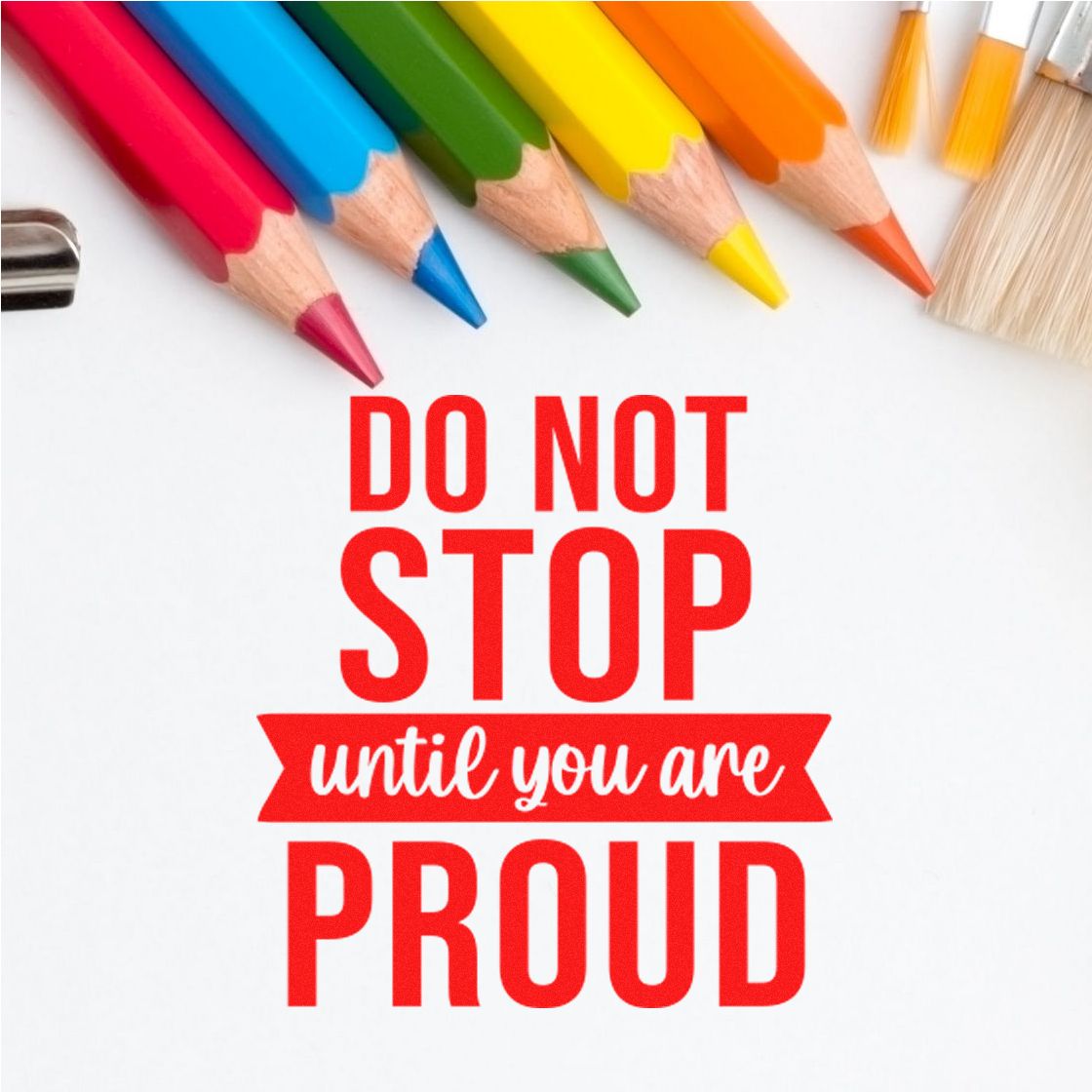 Red motivational stamp seal reading Do Not Stop Until You Are Proud, framed by colorful pencils and brushes on white.