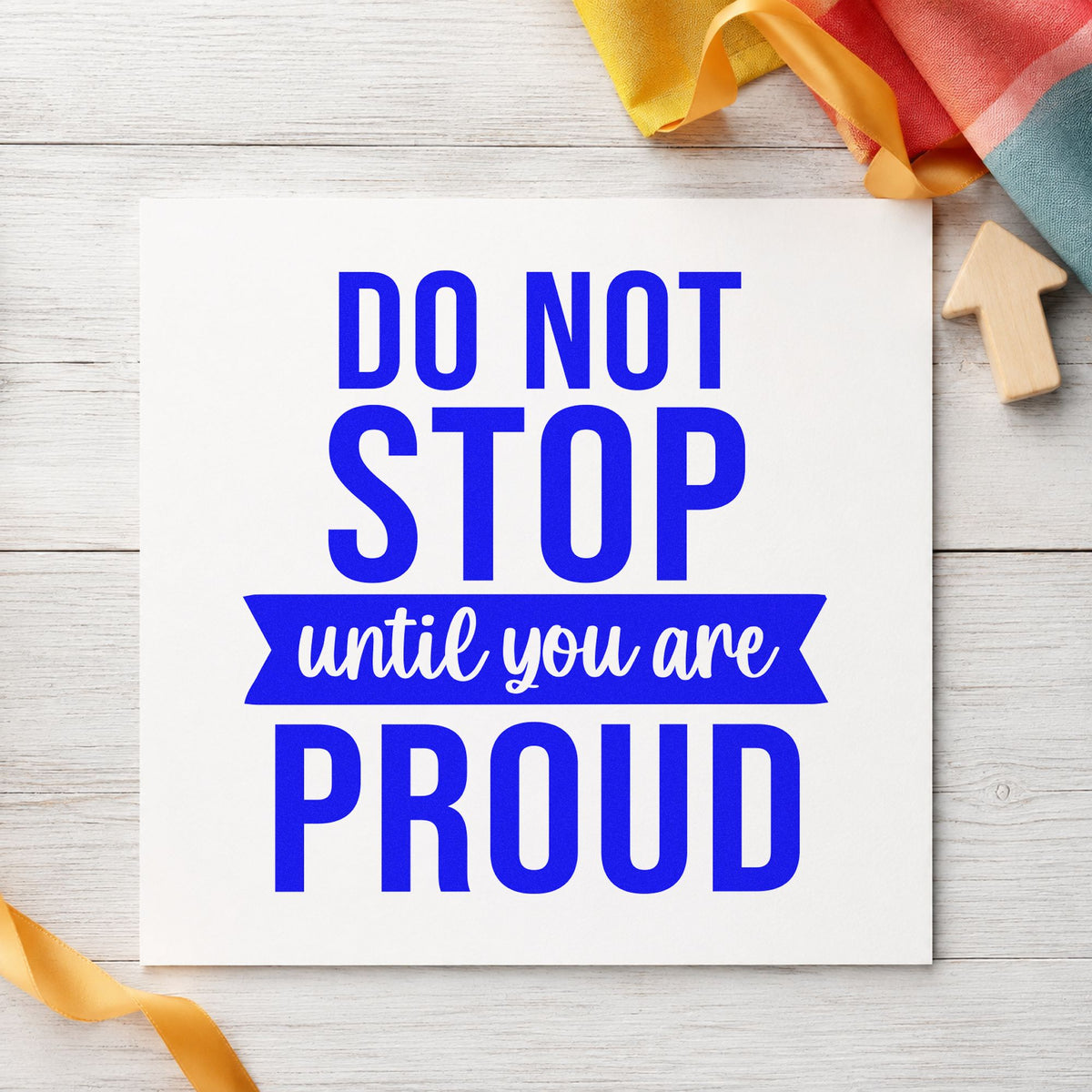 Don't Stop Until Proud craft stamp imprinted in blue ink on paper, a design suited to framed fair kitchen.