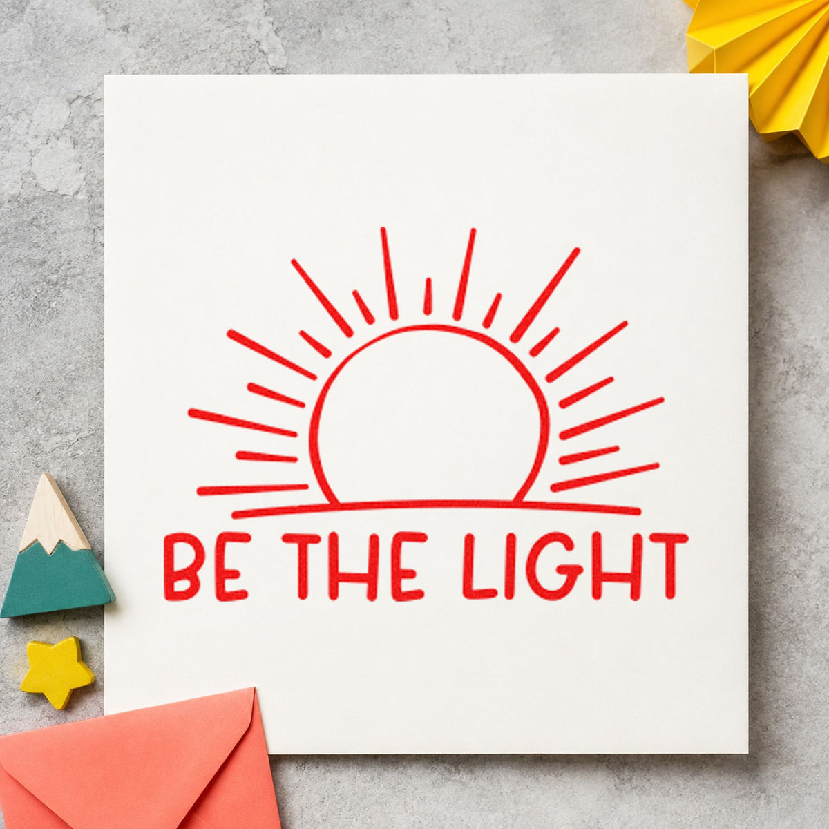 Be The Light Sunrise rubber stamp shown in red ink, stamped for projects such as bin light labels.
