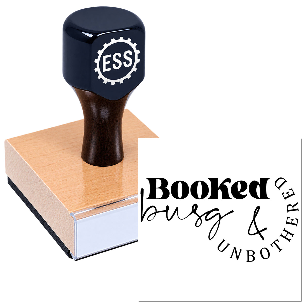 Black ESS embossing stamp on pink wood block with "Booked busy & unbothered" seal impression.