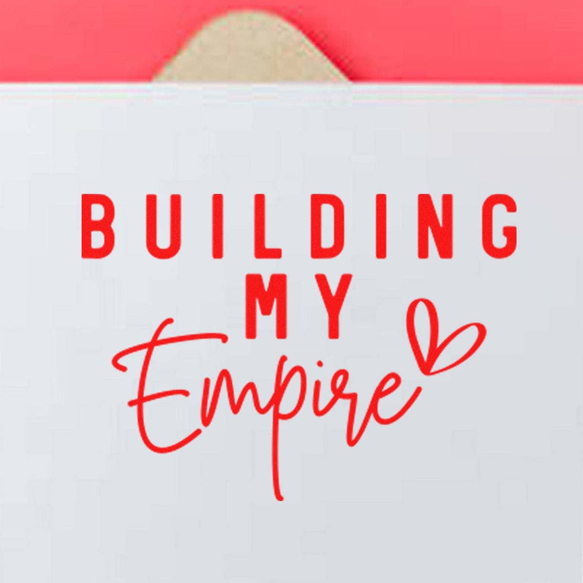 Red and white custom stamp seal reading Building My Empire with a heart accent.