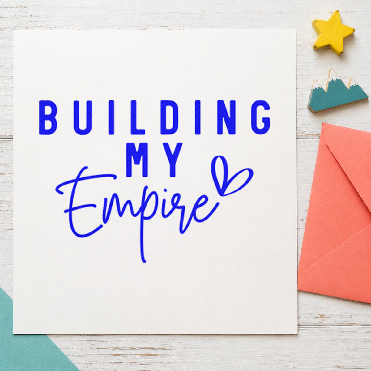 Building My Empire Heart craft stamp imprinted in blue ink on paper, a design suited to framed office corner.