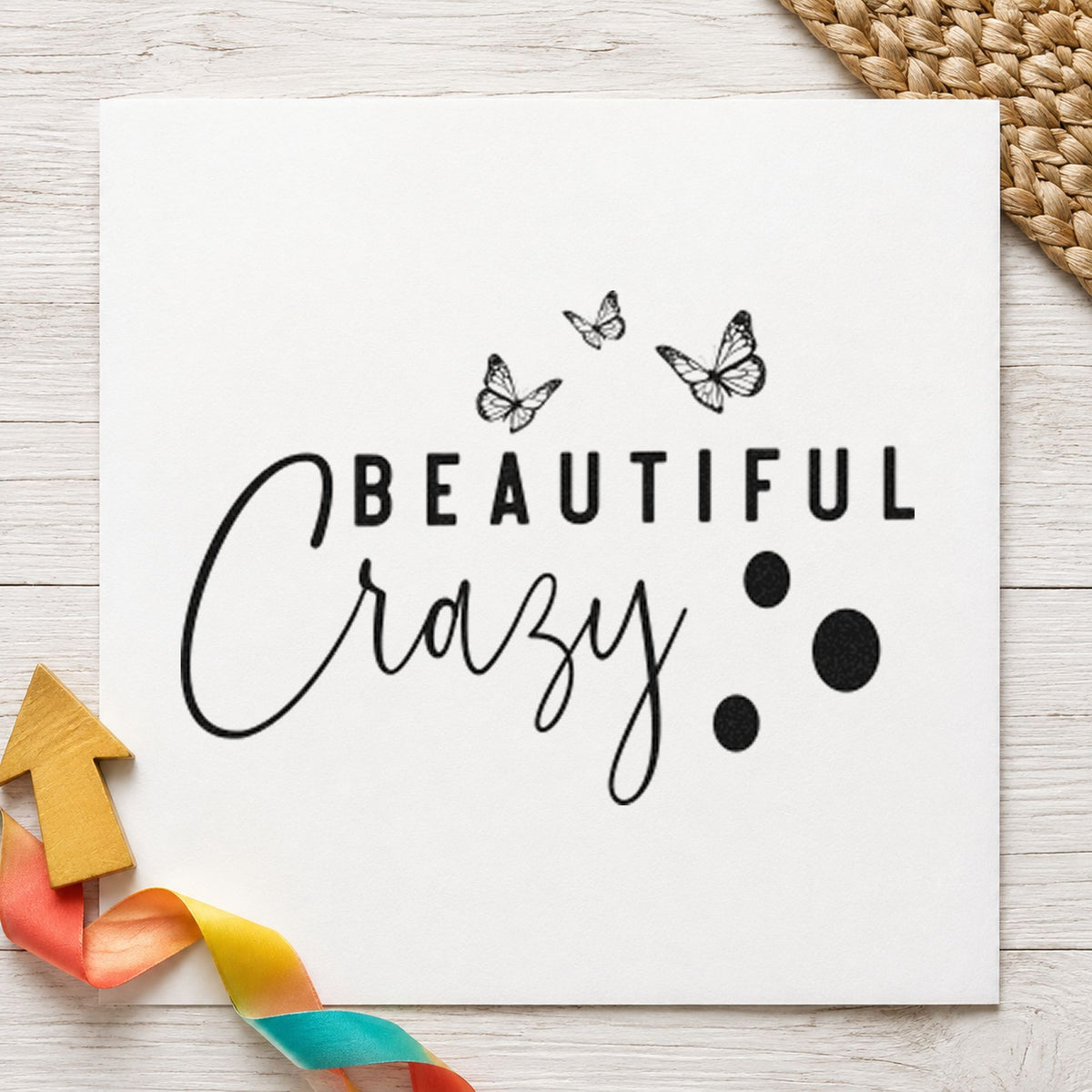 Beautiful Crazy Butterflies craft stamp imprint in black ink on a handmade project, one idea being welcome bag gift tags.
